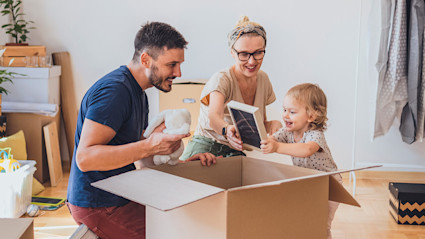 A photo of people packing up to move to another country.