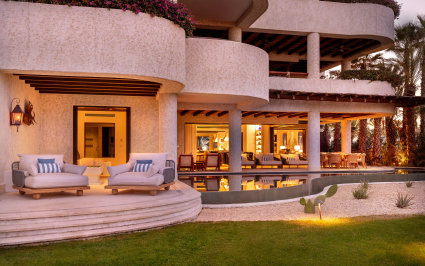A spacious vacation home in Cabo San Lucas with a pool and patio, offering a serene and luxurious living space.