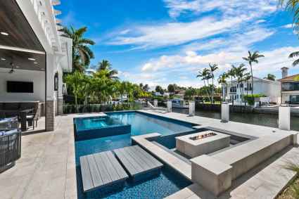 Hot tub and pool at a Fort Lauderdale second home with canal views