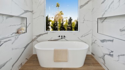 Marble walls with whit tub and window