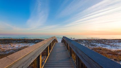 A boardwalk leads to the ocean at Henderson Beach State Park, one of the best beaches for kids in the South.