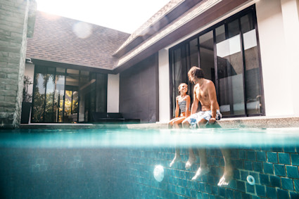 Dad with daughter in pool at home