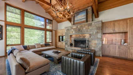 Modern mountain lodge in Lake Tahoe with stone fireplace
