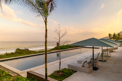 Bathroom with views of the ocean with large luxurious soaking tub and open-air shower.