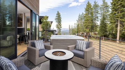 Outdoor porch with fire pit, hot tub and forest views