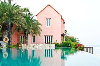 pink house with infinity pool