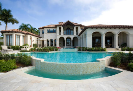 A photo of a mansion, one of the many types of vacation homes.