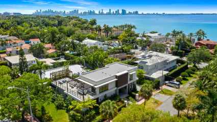 Aerial view of luxury vacation home with the Miami skyline in the background