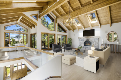 a living room with a fireplace and a large glass table