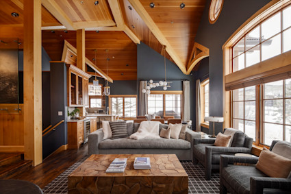 Alpine ridge living room with furniture arranged around a coffee table.