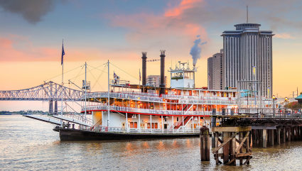 A river boat leaves the dock in New Orleans, one of the best vacation spots for couples.