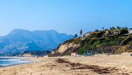 A photo of Malibu, California serves as inspiration for a momcation.