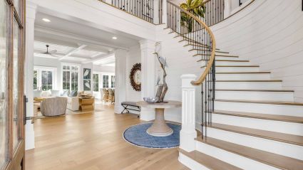 curved staircase of a modern elegant second home on Hilton Head Island