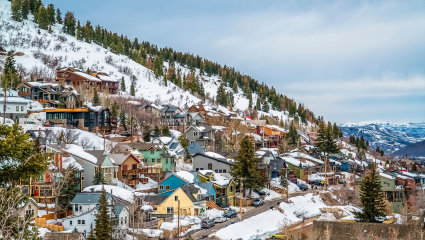 Houses cover the snowy mountainside of Park City, Utah, embodying why it’s one of the best places for a second home. 
