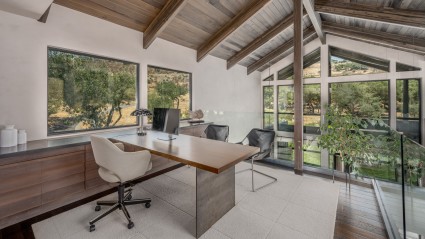 Upper-floor office with large vaulted ceilings