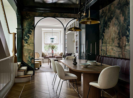 Moody dining room with tapestry and cream chairs in Infinity by Pacaso home in Washington, D.C.
