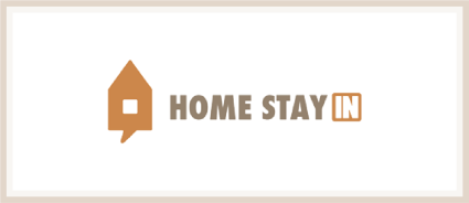 A logo of Homestayin, one of the many Plum Guide alternatives.