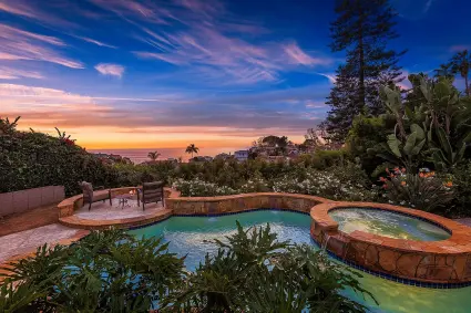 round pool and hot tub overlooking sunset