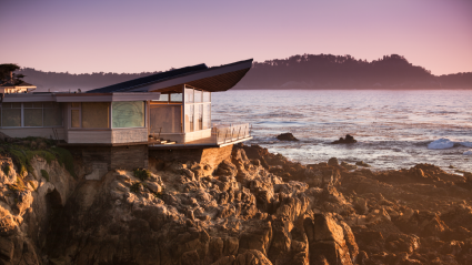 A photo shows a home on a cliff, one of the best places to buy a vacation home.