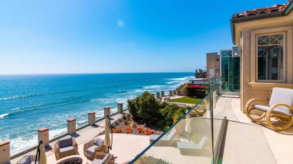 Views of the Pacific ocean and patio from a balcony at an Encinitas second home