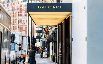 A street view shows the Bulgari sign above its entrance. Several luxury London hotels are located in this upscale district.