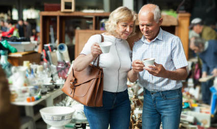 Two people go antiquing while exploring what to do after retirement.
