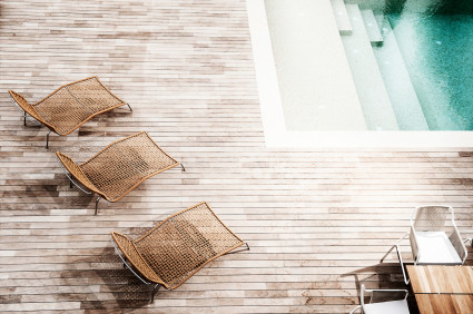 aerial shot of chairs by pool steps