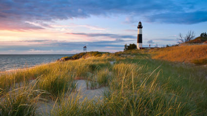 A photo of a lighthouse at the Great Lakes, where people can enjoy exploring empty nest ideas.