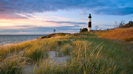 Lighthouse on the Lake Michigan shoreline on a clear summer day