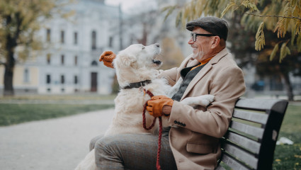 A man bonds with his dog at a park in Cleveland, Ohio during one of their many pet-friendly vacations.