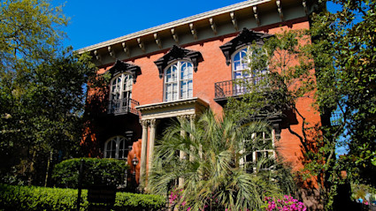 Historic mansion on a shaded square in Savannah, Georgia, a popular stop on ghost tours