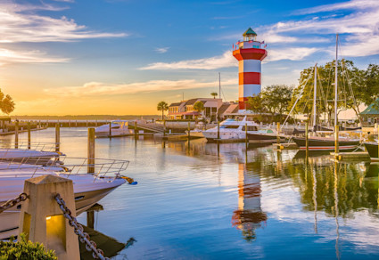 The red-and-white striped Harbour Town Lighthouse in Hilton Head, a gem among the best east coast beach towns.