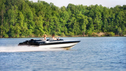 A photo of people boating, one of the many empty nest ideas to try.