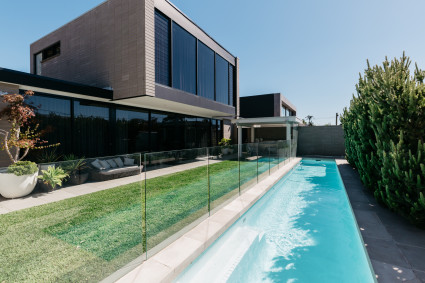 modern home with grass and pool