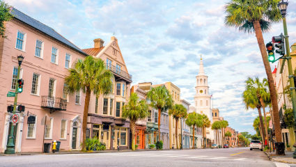 Palm trees and old fashioned buildings line the downtown streets of Charleston, South Carolina, embodying why it’s one of the best places for a second home.