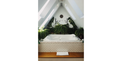 spa tub with plants surrounding