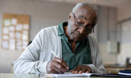 A person sits down to write a book while exploring what to do after retirement.