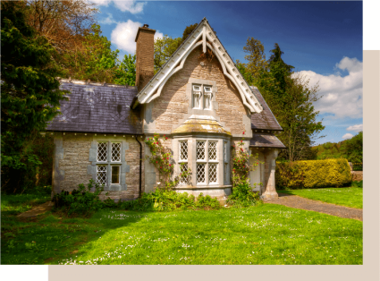 An image displays a traditional Cottage home, one of the main types of houses.