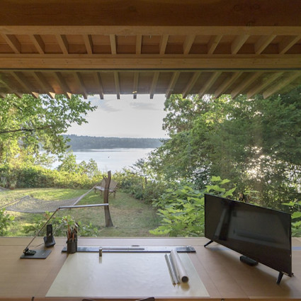 Office overlooking lake and trees