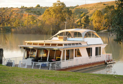A photo of a houseboat, one of the many types of vacation homes.
