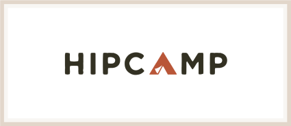 A logo of Hipcamp, one of the many Plum Guide alternatives.