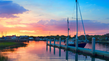 A sailboat sits against the dock in Charleston,one of the best vacation spots for couples.
