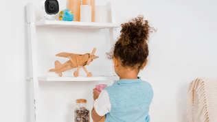 Child playing near security camera