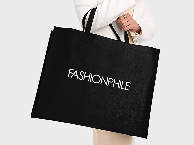 Image of person holding Fashionphile SWAG tote