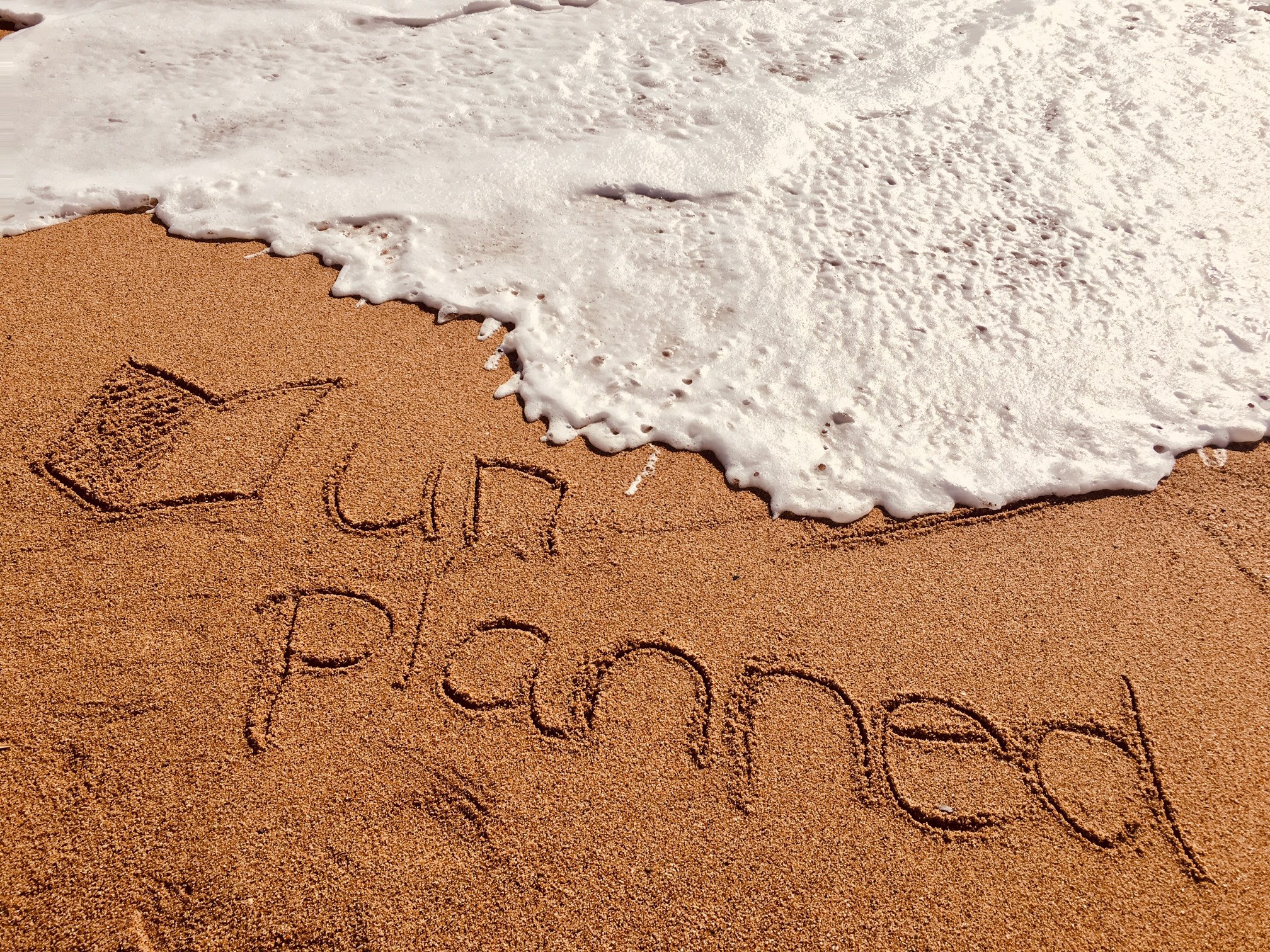 Unplanned-Logo-im-Sand
