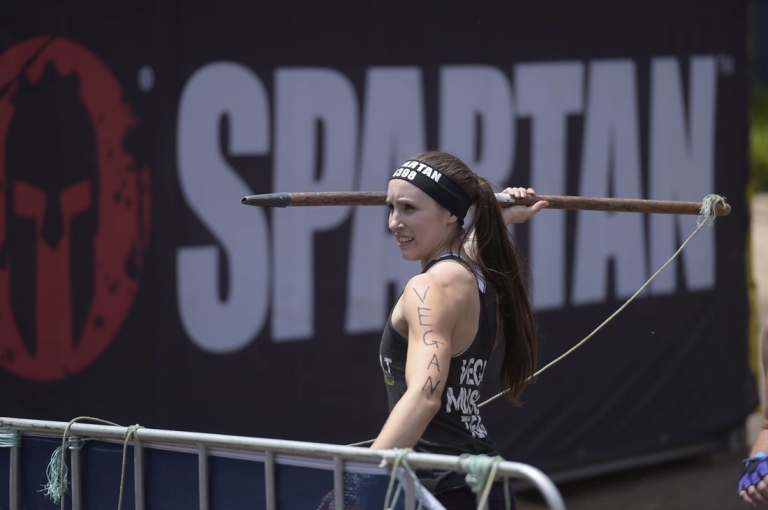 Simone Collins throwing a spear