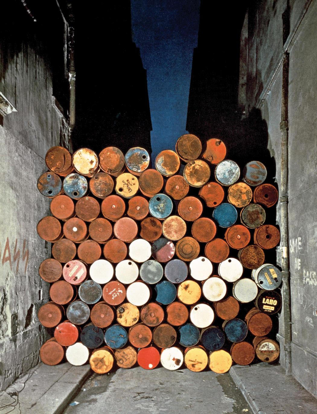 Christo   jeanne claude  wall of oil barrels     the iron curtain  rue visconti  paris  1961 62