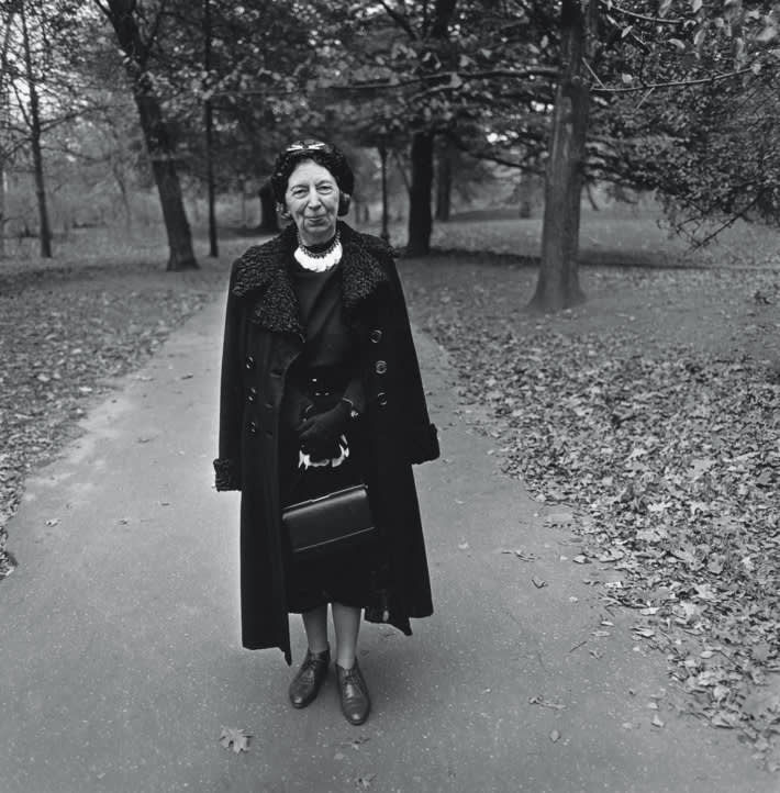 Woman in long coat and dark hat  central park  n.y.c. 1962. photo  diane arbus copyright 