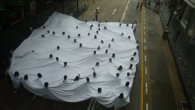 Lygia pape s 1968 performance    divisor    restaged in hong kong. 