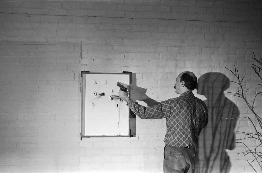  Niki de Saint Phalle, Participant, takes aim at one of two versions of Untitled Edition MAT 64 